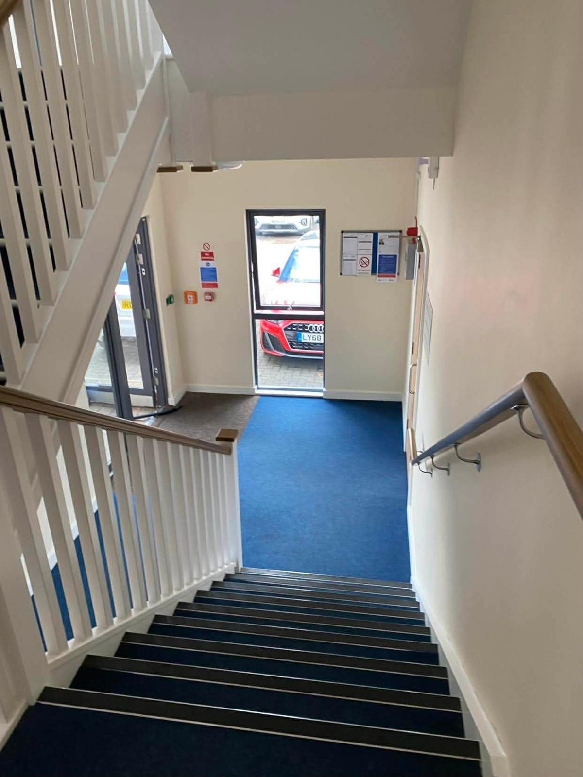 View down the Kingston stairwell to the ground floor entrance and notice board