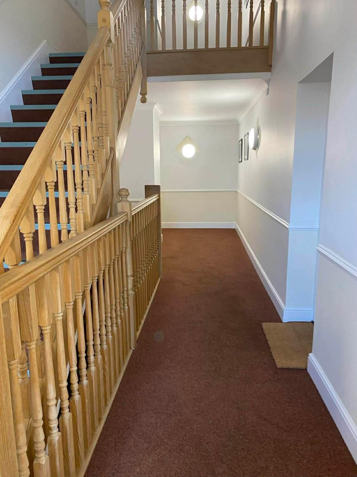 First floor landing in the Sutton block looking along the carpeted corridor