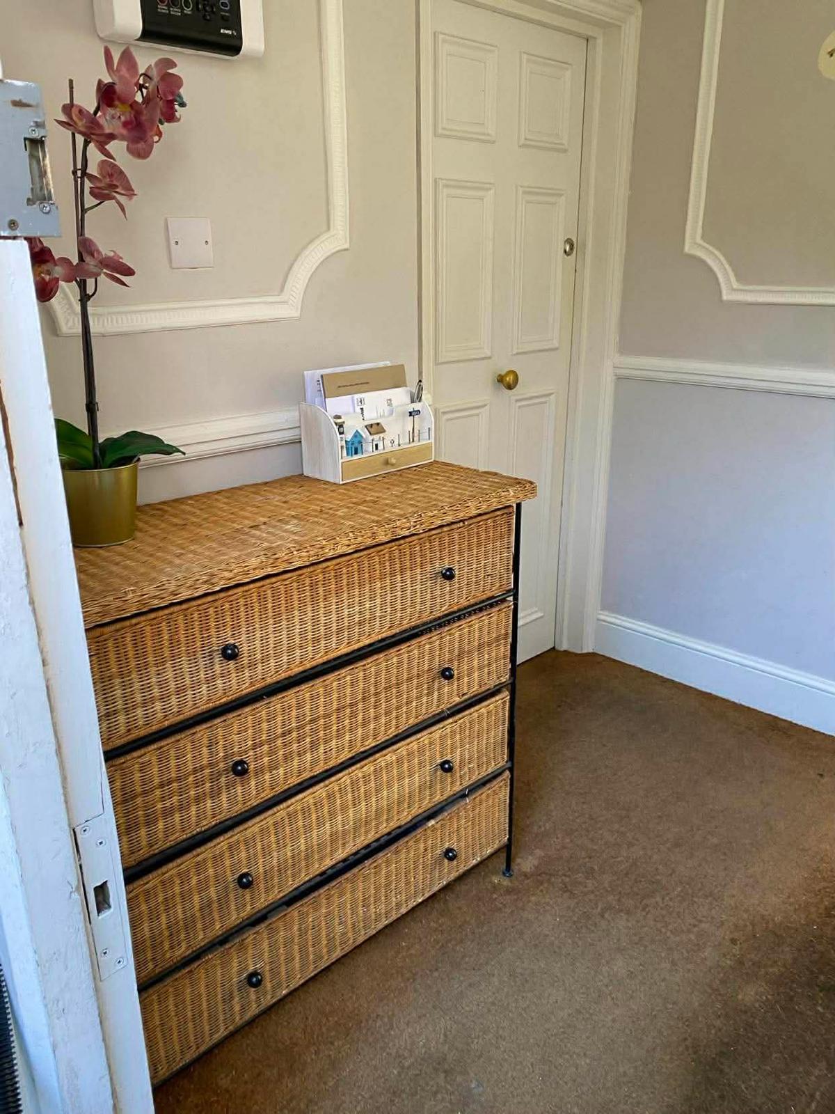 Entrance hall of the first Wallington block with a post table and panelled walls