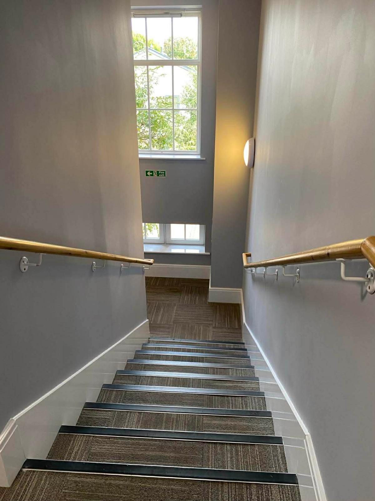 Stairwell window above the carpet-tiled stair in the second Wallington block