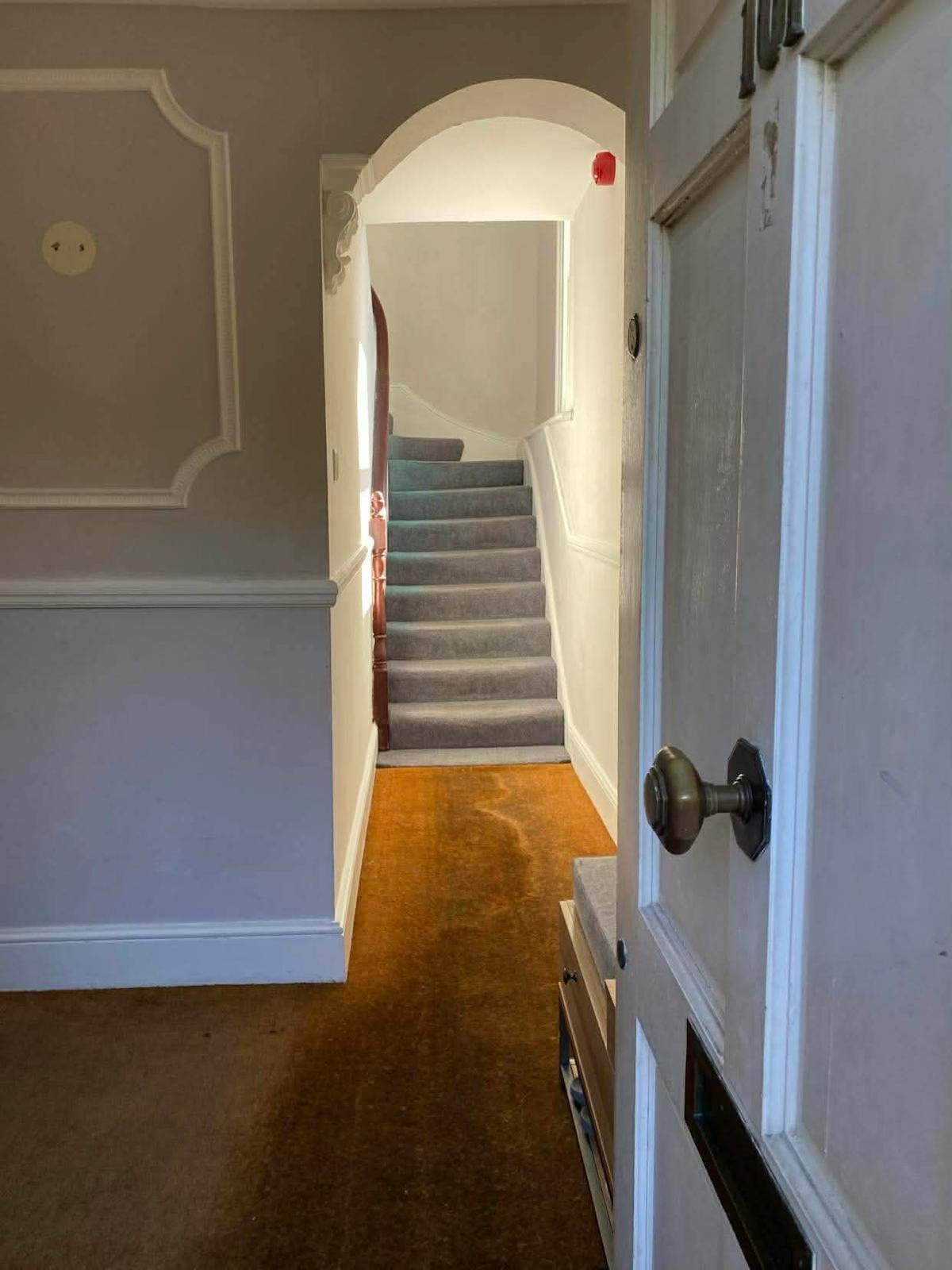 Ground floor hall and stair of the first Wallington block seen from the entrance door