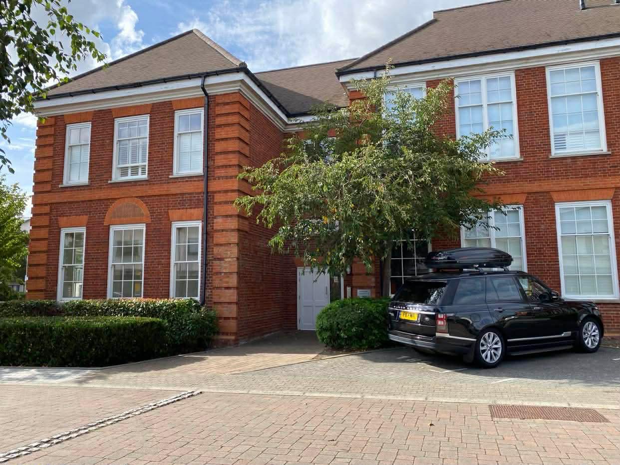 Red brick exterior and block-paved parking courtyard at the Wimbledon development