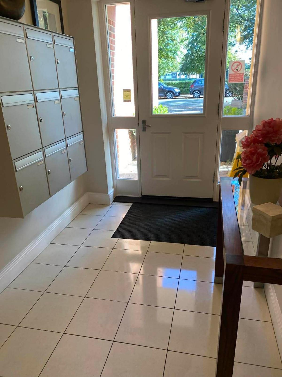 Second entrance lobby at the Wimbledon development with post boxes and barrier matting